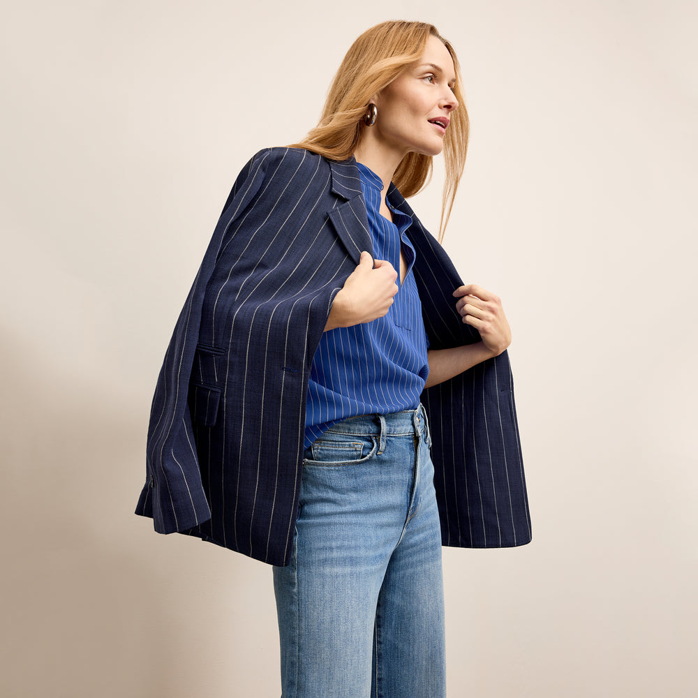 front image of a woman wearing the kylan top in soft stripe