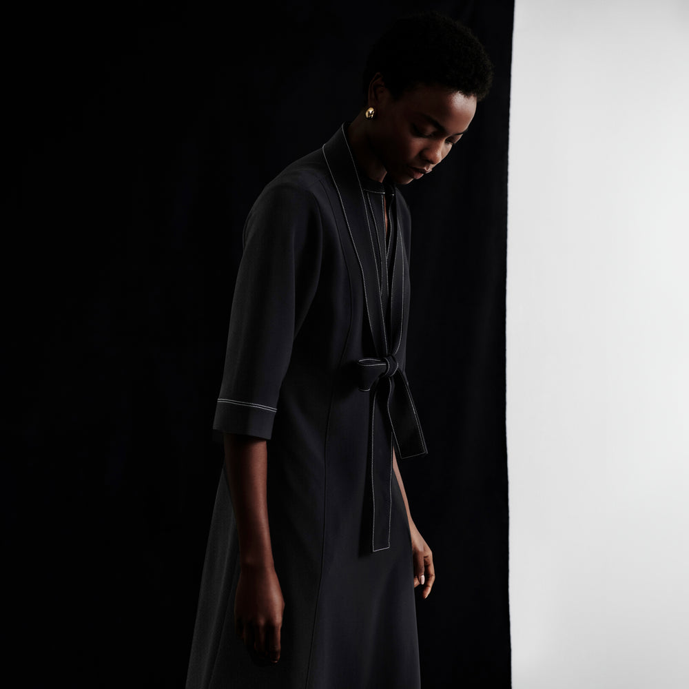 front image of a woman wearing the lauleh dress in black