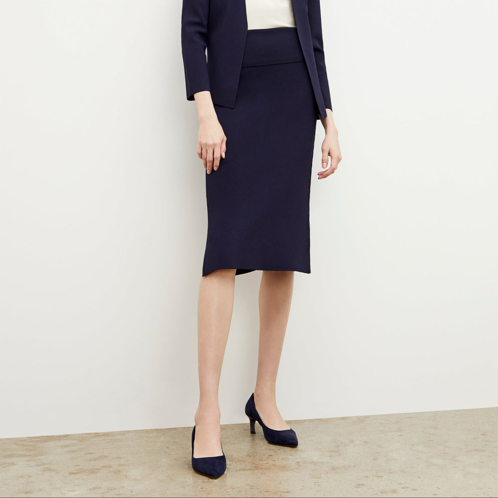 Front image of a woman wearing the harlem skirt in navy