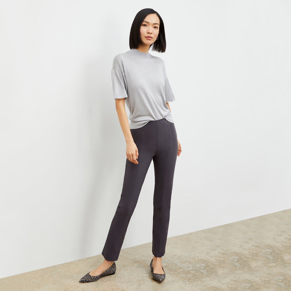 Front image of a woman standing wearing the foster pant in monsoon