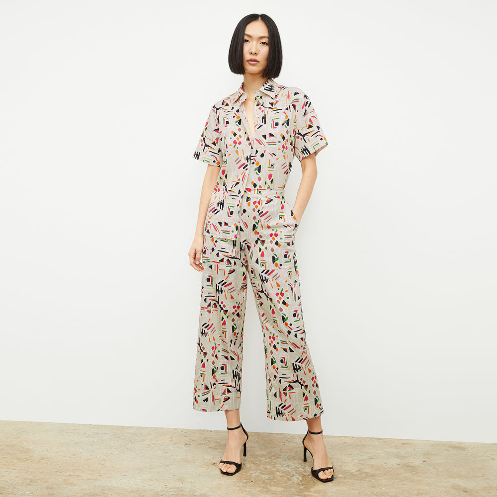 front image of a woman wearing the livingston top in rhythm print