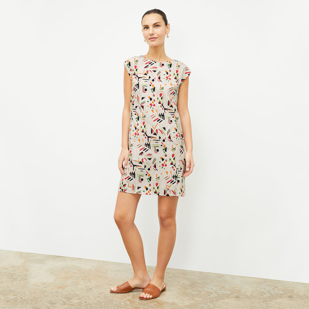 front image of a woman wearing the maaza dress in rhythm print