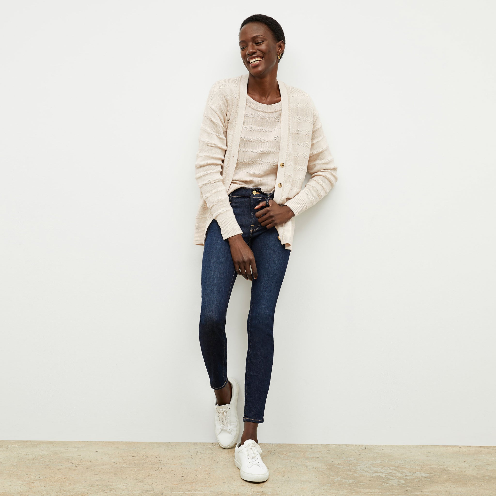 front image of a woman wearing the cookie cardigan in moonbeam 