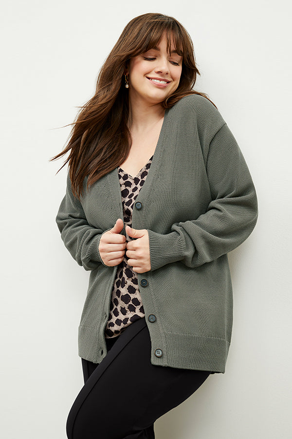 front image of a woman wearing the cookie cardigan in fossil