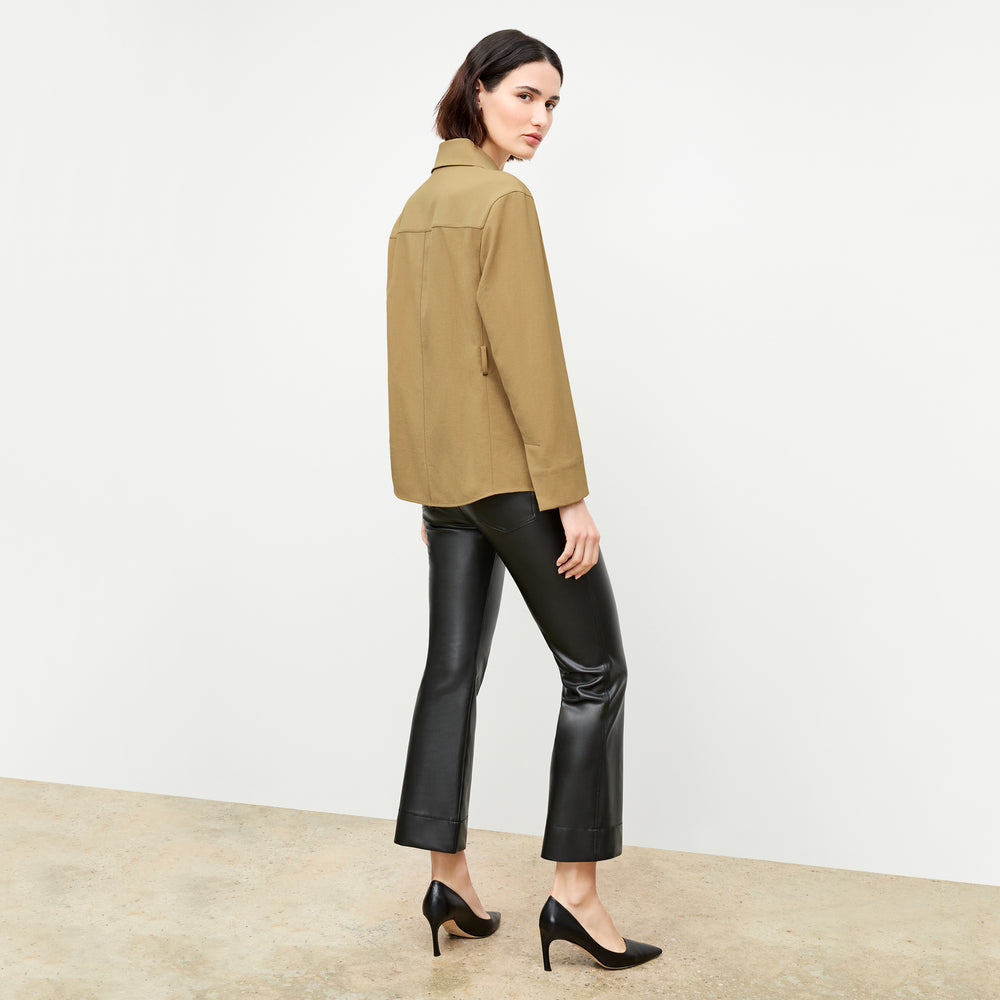 back image of a woman wearing the avelyn jacket in macaroon