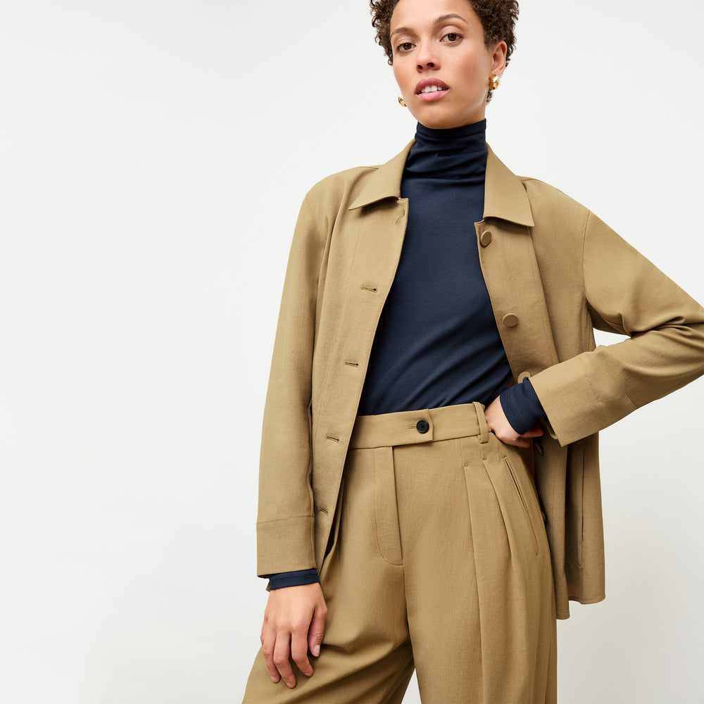 front image of a woman wearing the avelyn jacket in macaroon