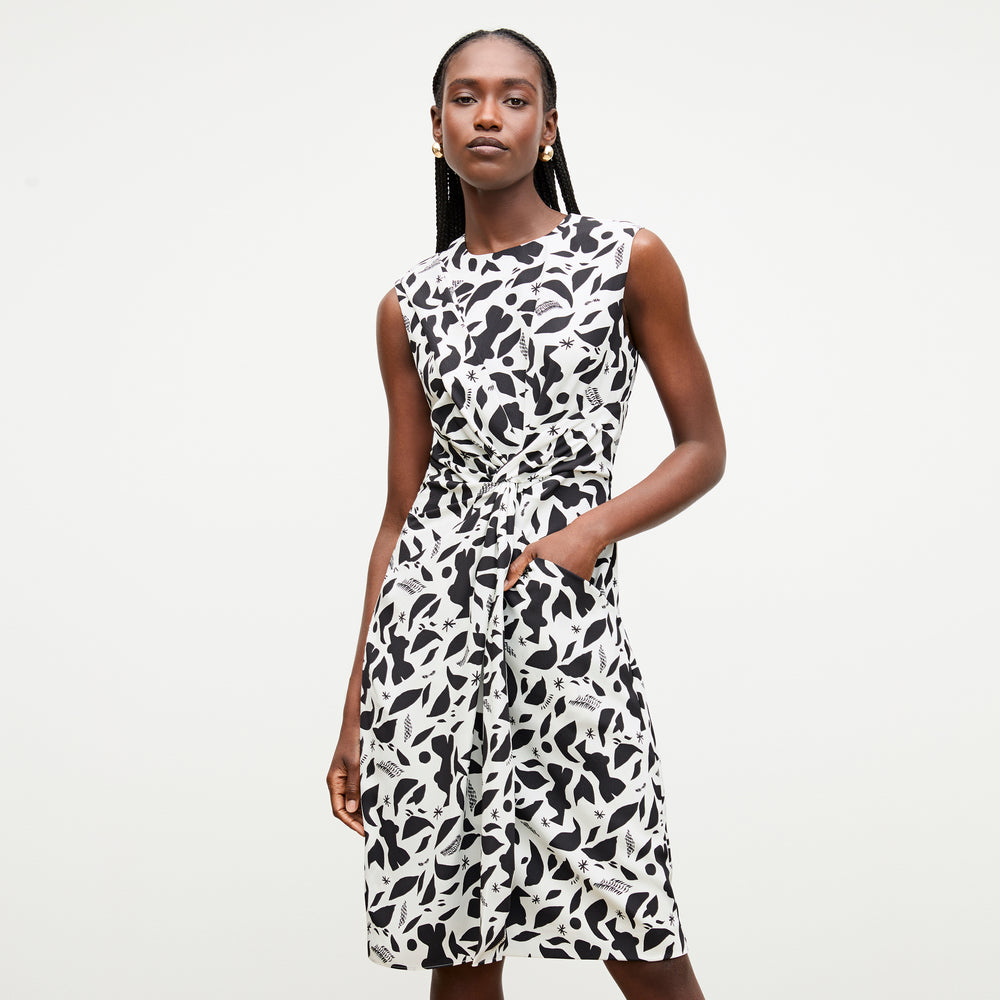 front image of a woman wearing the taylor dress in icon print