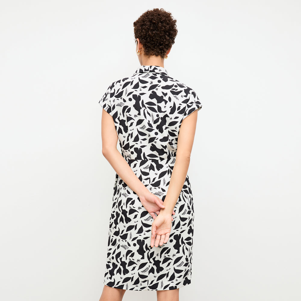 back image of a woman wearing the tory dress in icon print