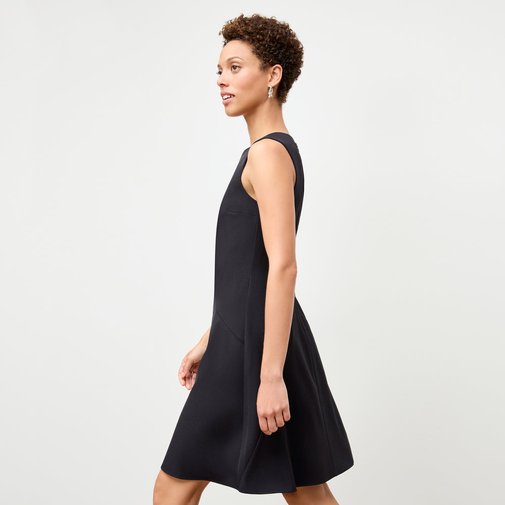 side image of a woman wearing the pauline dress in black
