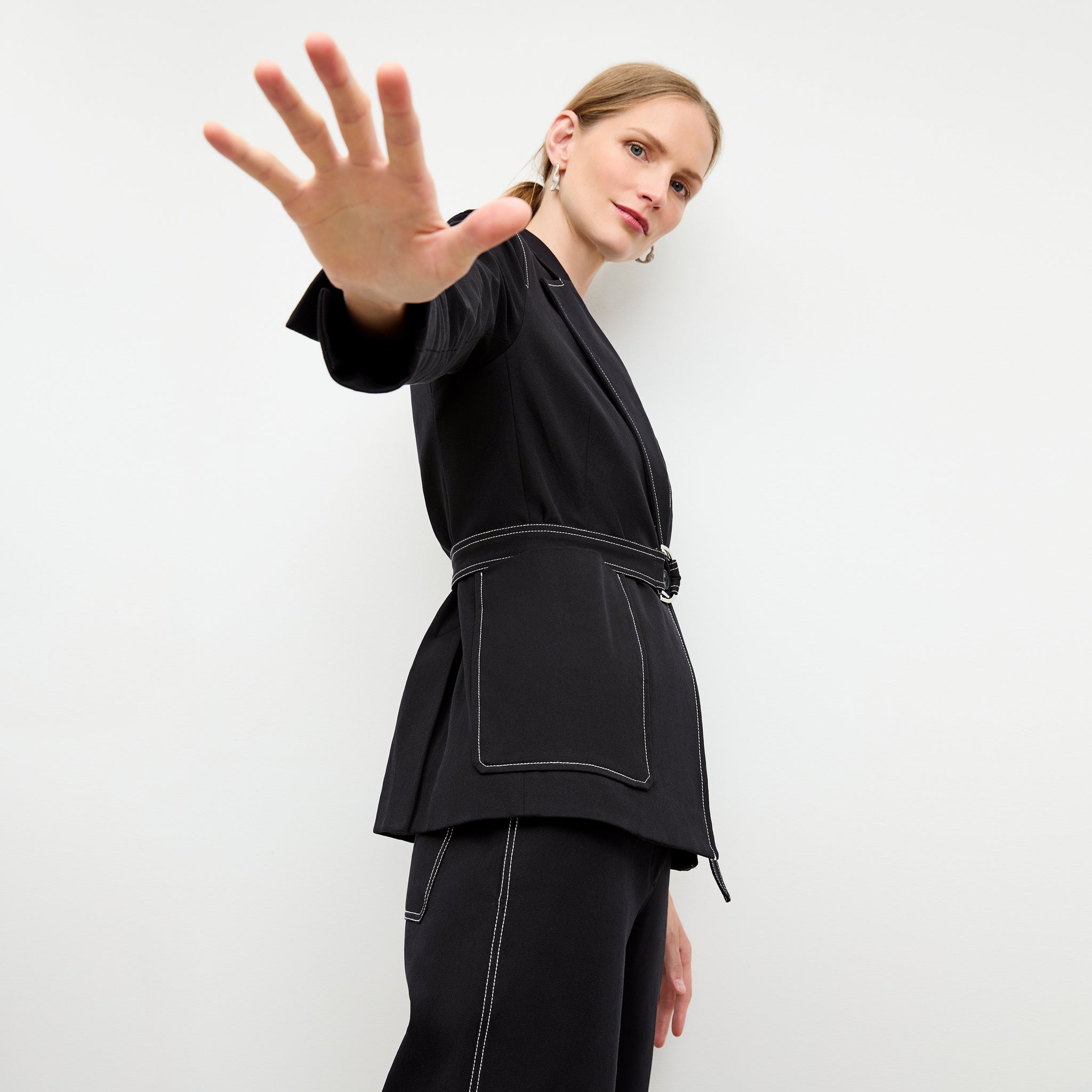 side image of a woman wearing the grenville jacket in black 