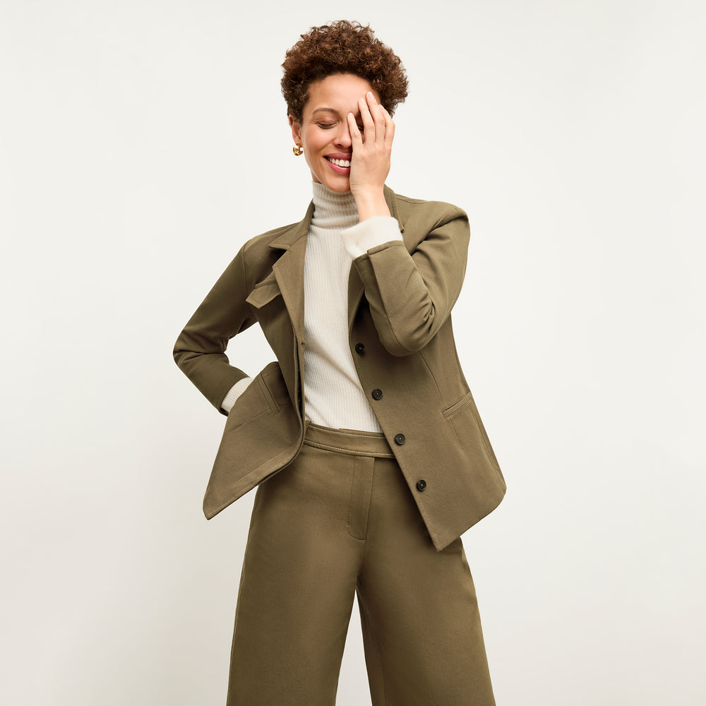 front image of a woman wearing the abby pant in oregano