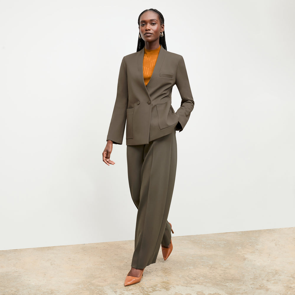 front image of a woman wearing the montean top in caramel