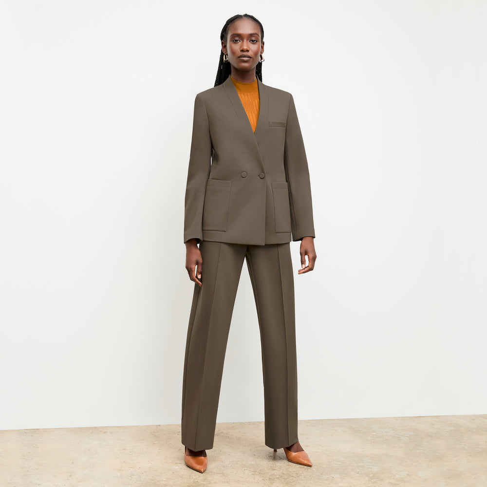 front image of a woman wearing the montean top in caramel