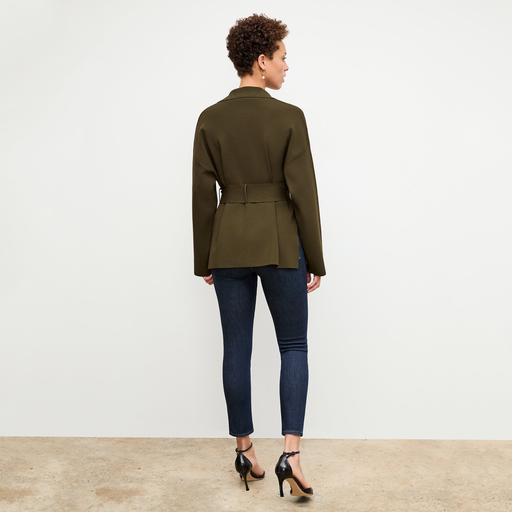 back image of a woman wearing the yuwei jardigan in dark elm