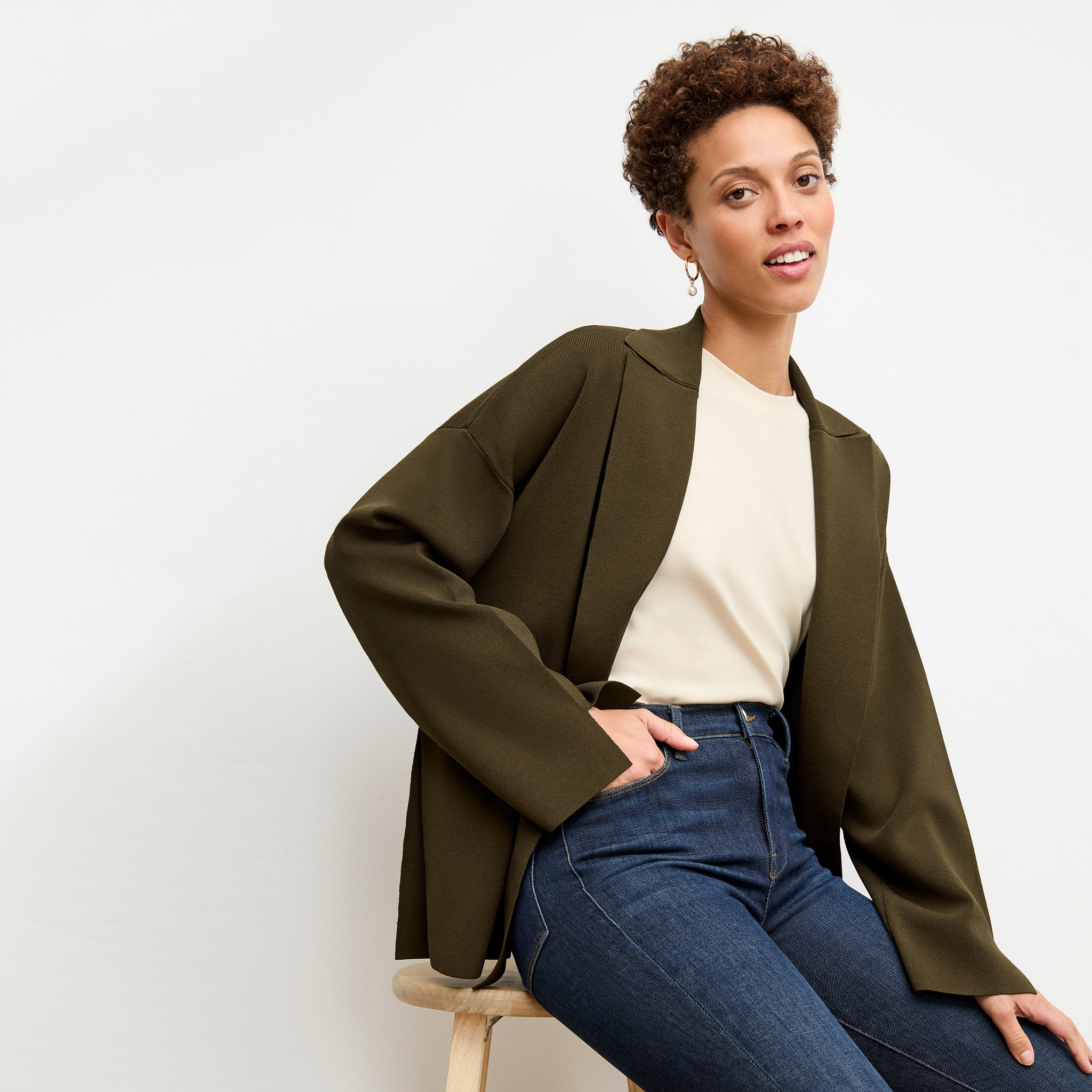 front image of a woman wearing the yuwei jardigan in dark elm