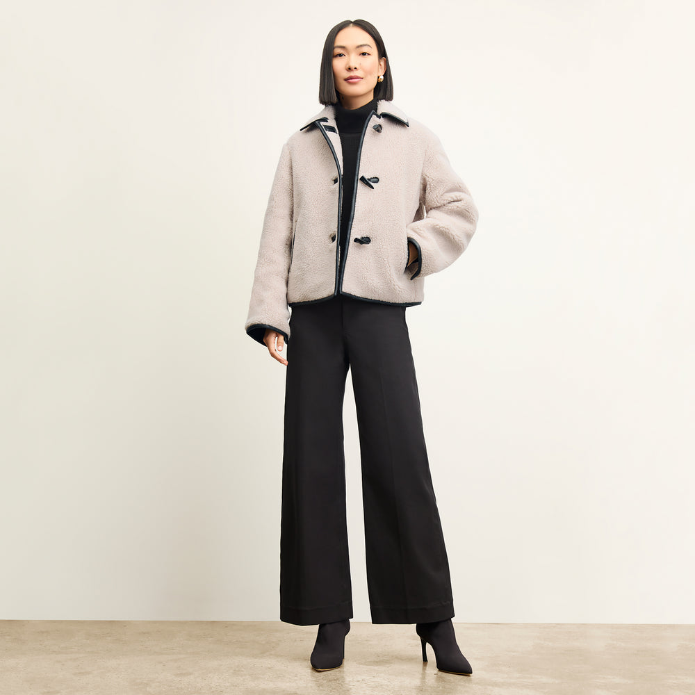Front image of a woman wearing the Milo Jean in Black
