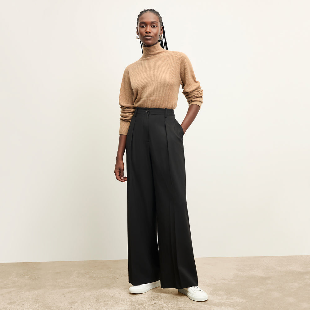front image of a woman wearing the mckenzie sweater in deep flax
