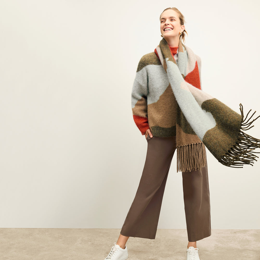 front image of a woman wearing the rajni sweater in multi