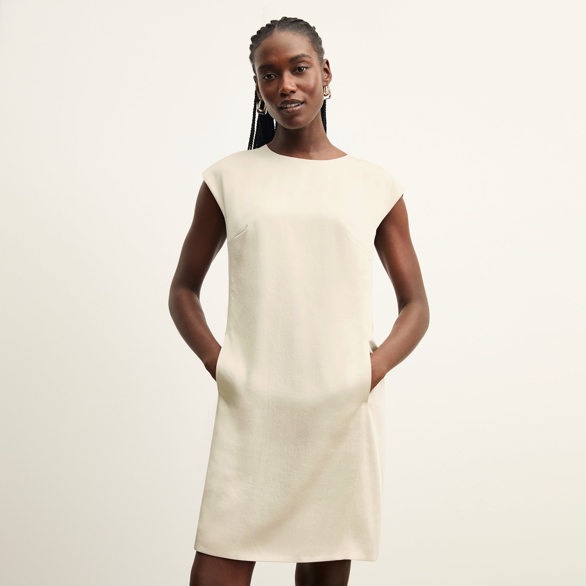 front image of a woman wearing the maaza dress in champagne 