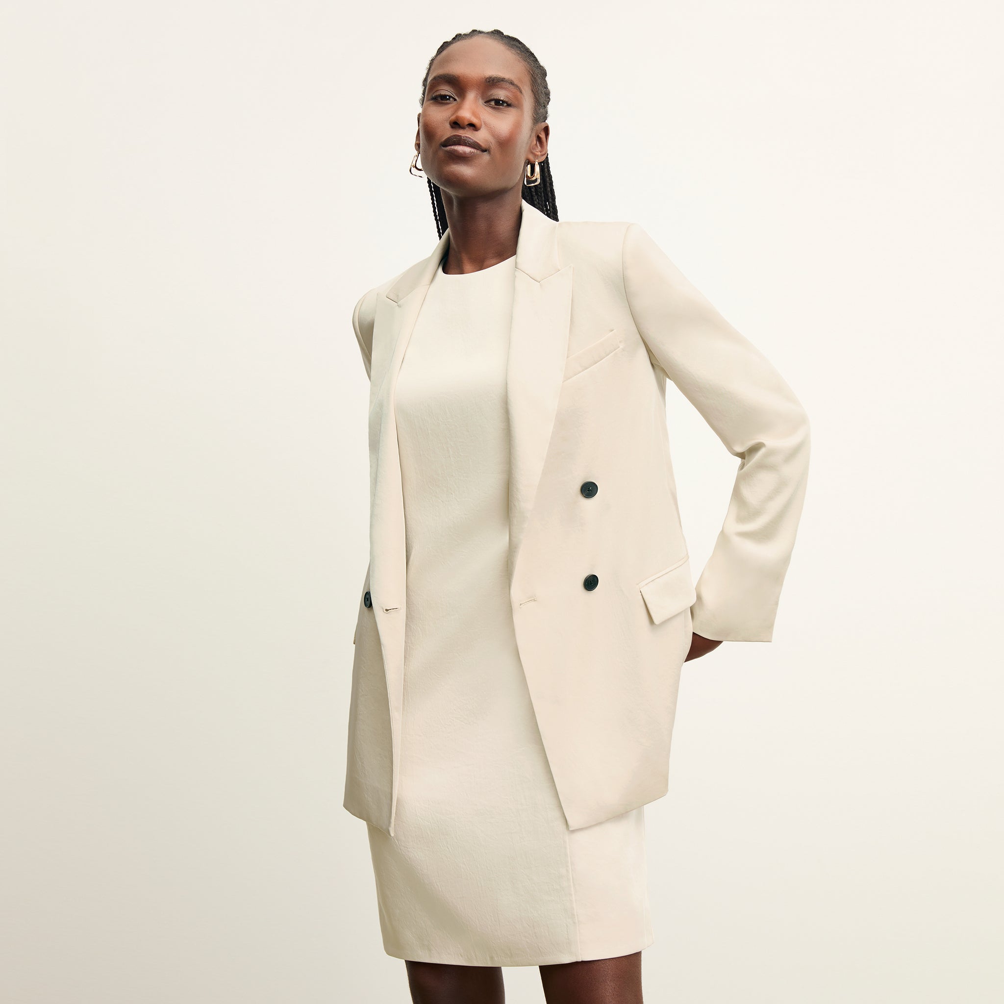 front image of a woman wearing the maaza dress in champagne