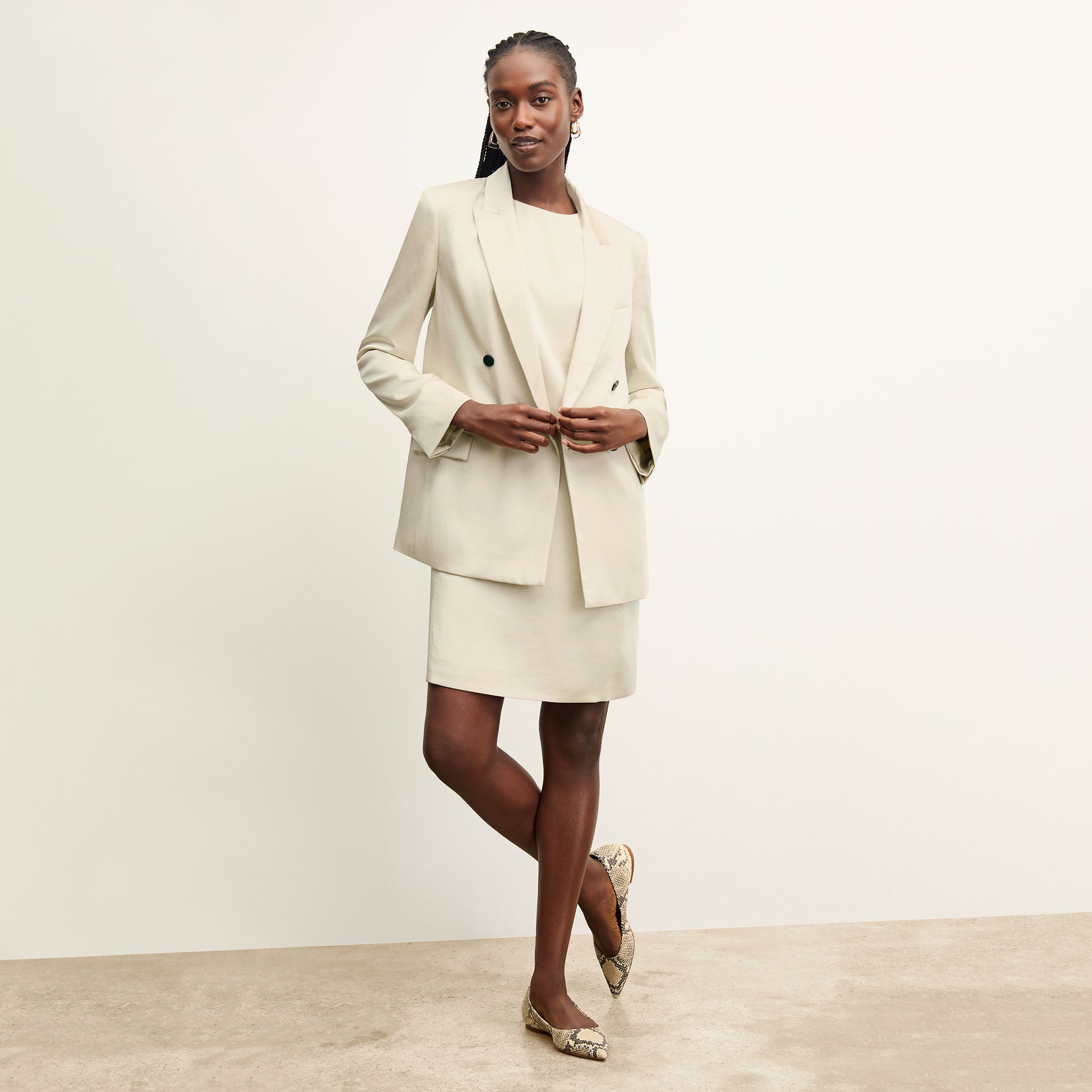 front image of a woman wearing the maaza dress in champagne