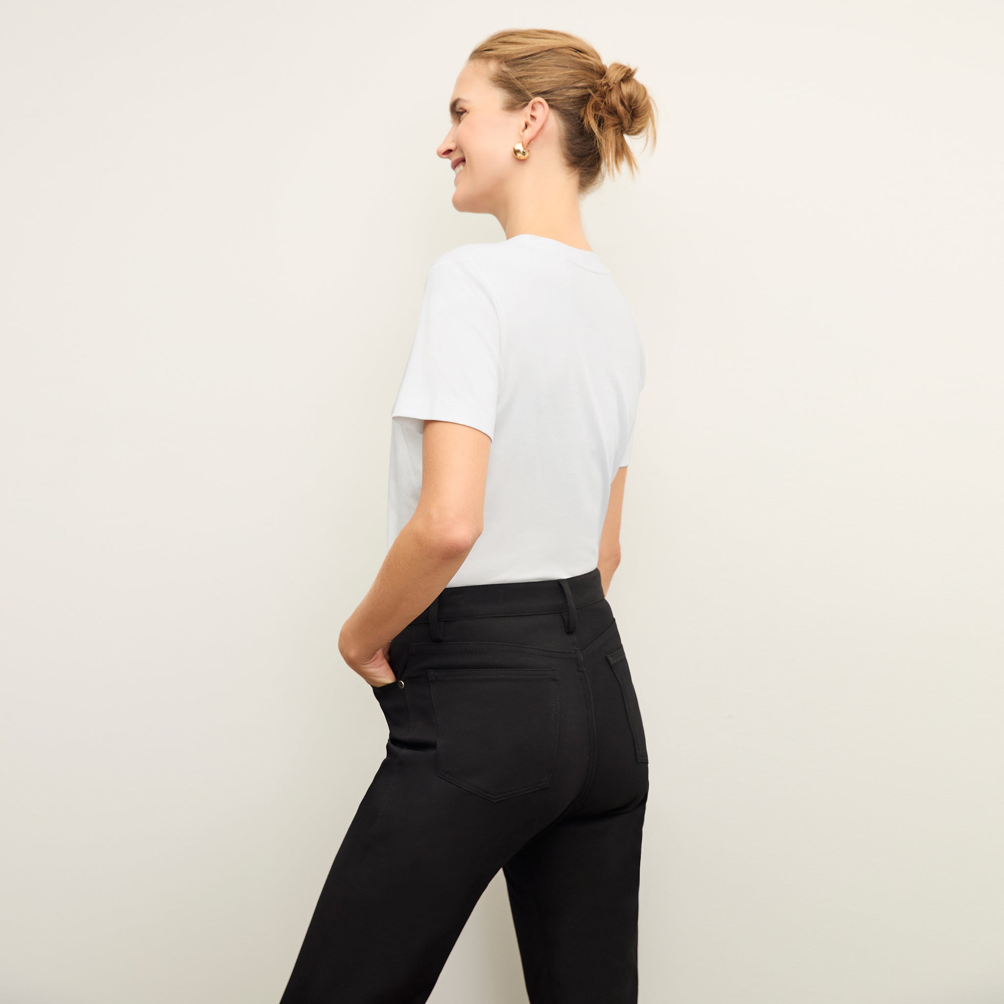 back image of a woman wearing the Lee T-Shirt in White