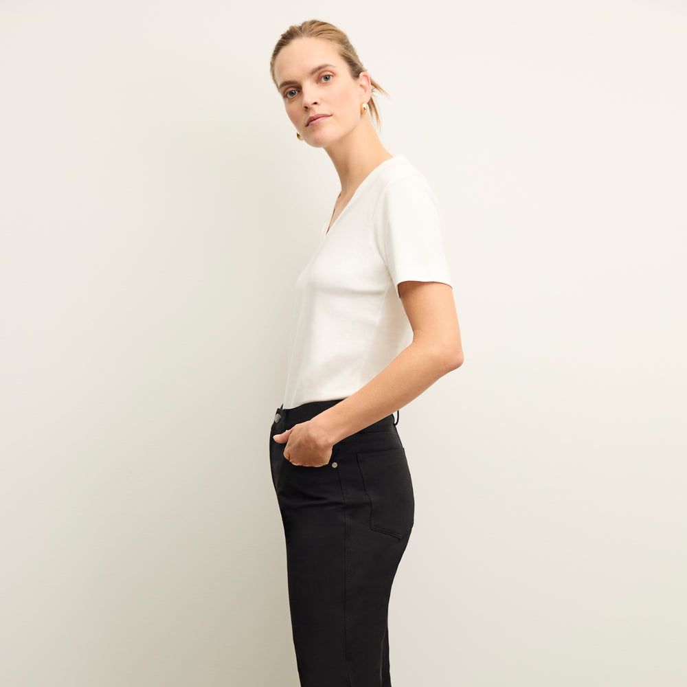side image of a woman wearing the Lee T-Shirt in White