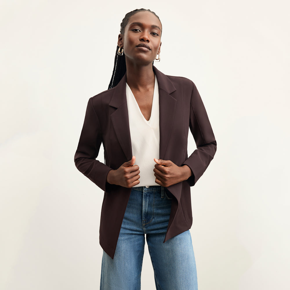 front image of a woman wearing the moreland jacket in wine over her shoulder