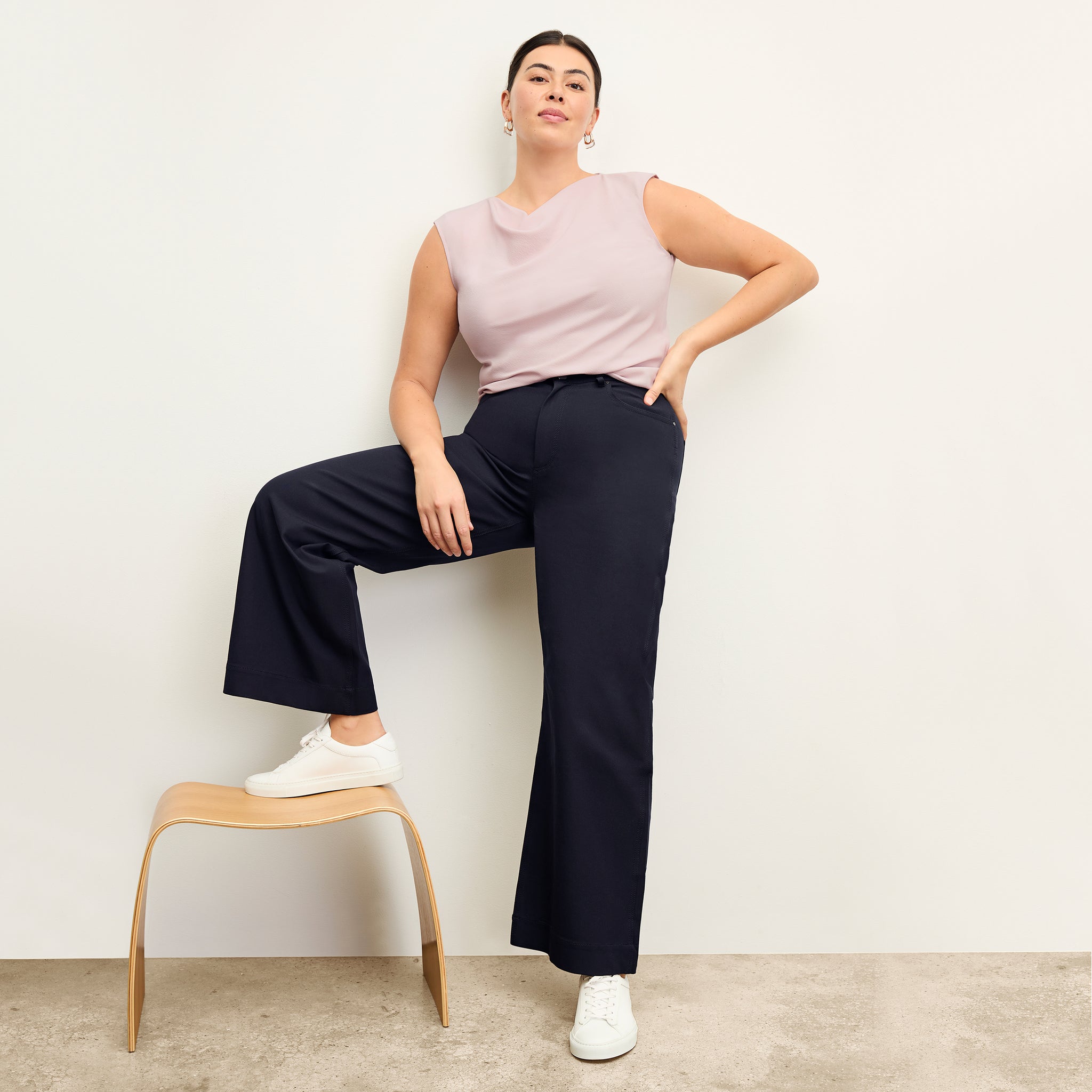 front image of a woman wearing the nora top in blossom