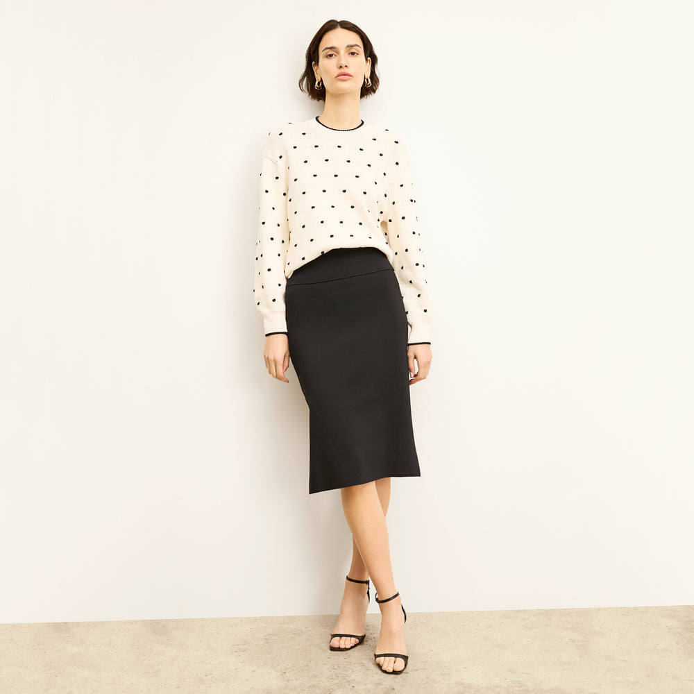 front image of a woman wearing the kim sweater in dot knit