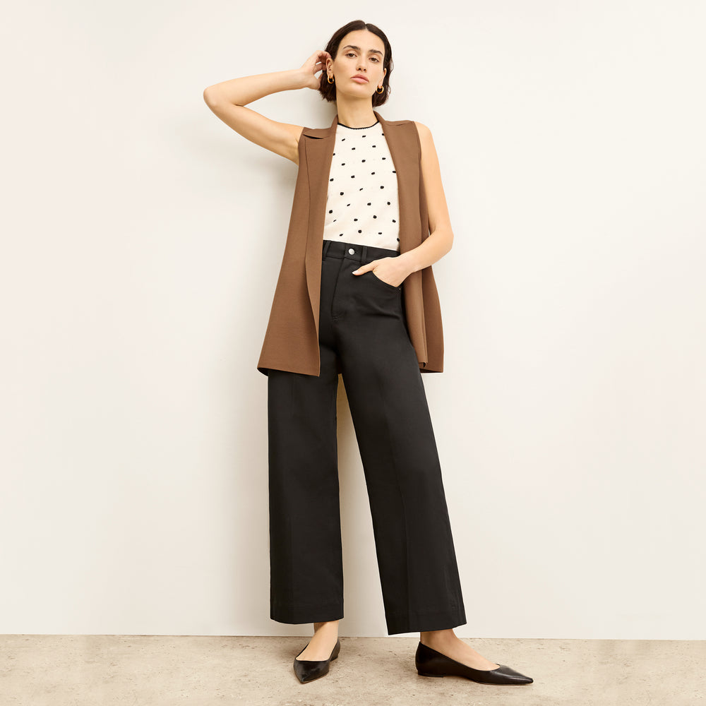 front image of a woman wearing the patty top in dot knit