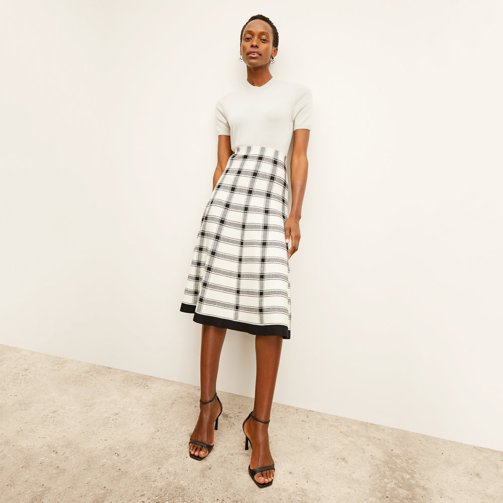 front image of a woman wearing the marlowe skirt in bold check