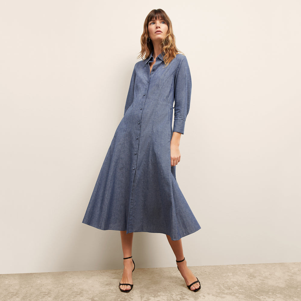 front image of a woman wearing the pepper dress in clear blue