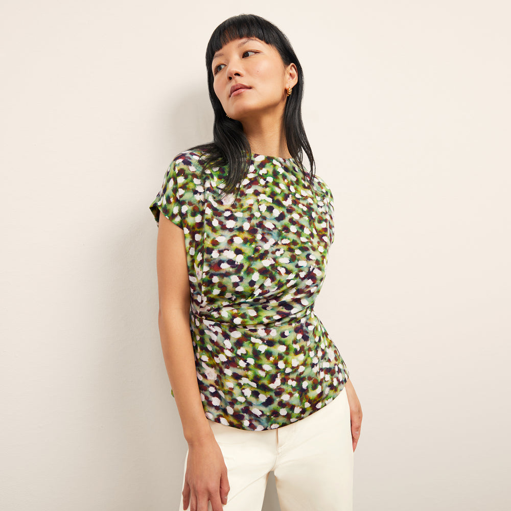 front image of a woman wearing the nejvi top in spotlight print