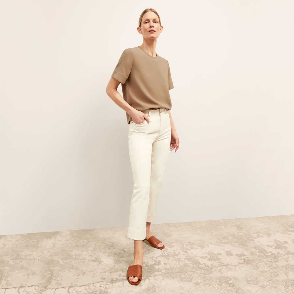 Front image of a woman wearing the Archie Jean in Tusk
