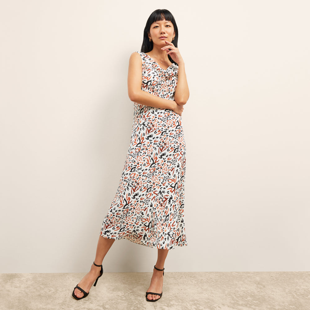 front image of a woman wearing the priya dress in leopard sketch