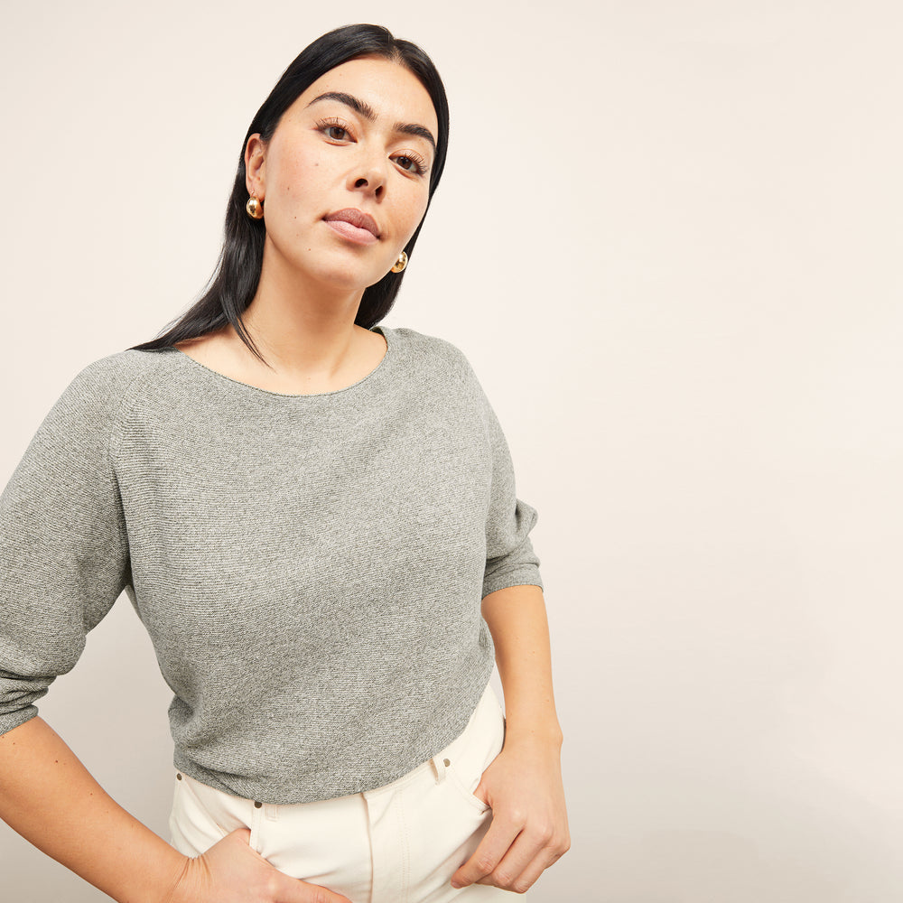 front image of a woman wearing the chadwick sweater in olive melange