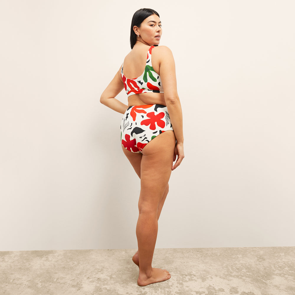 image of a woman wearing the M.M.LaFleurxAndie Portofina Bikini Bottom in cutout floral