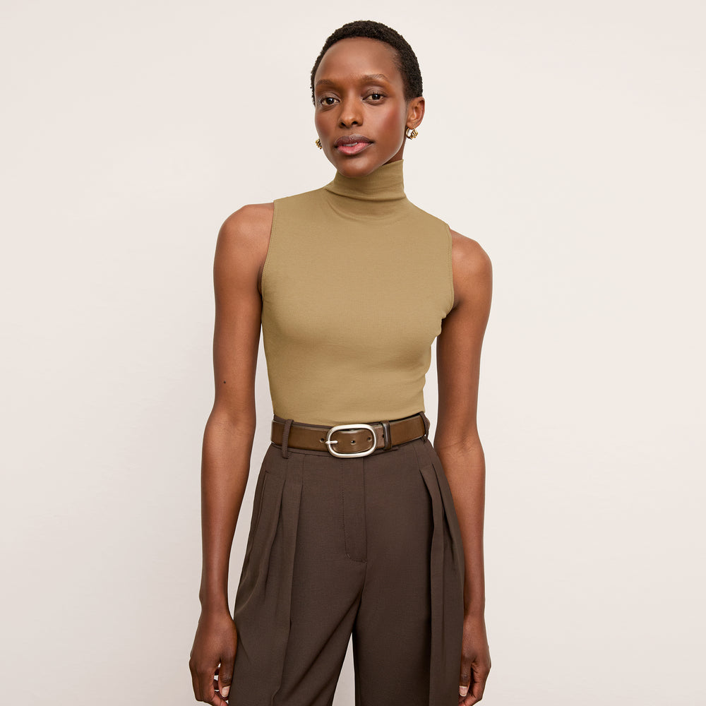 Front image of a woman wearing the Jett Tank in Saddle