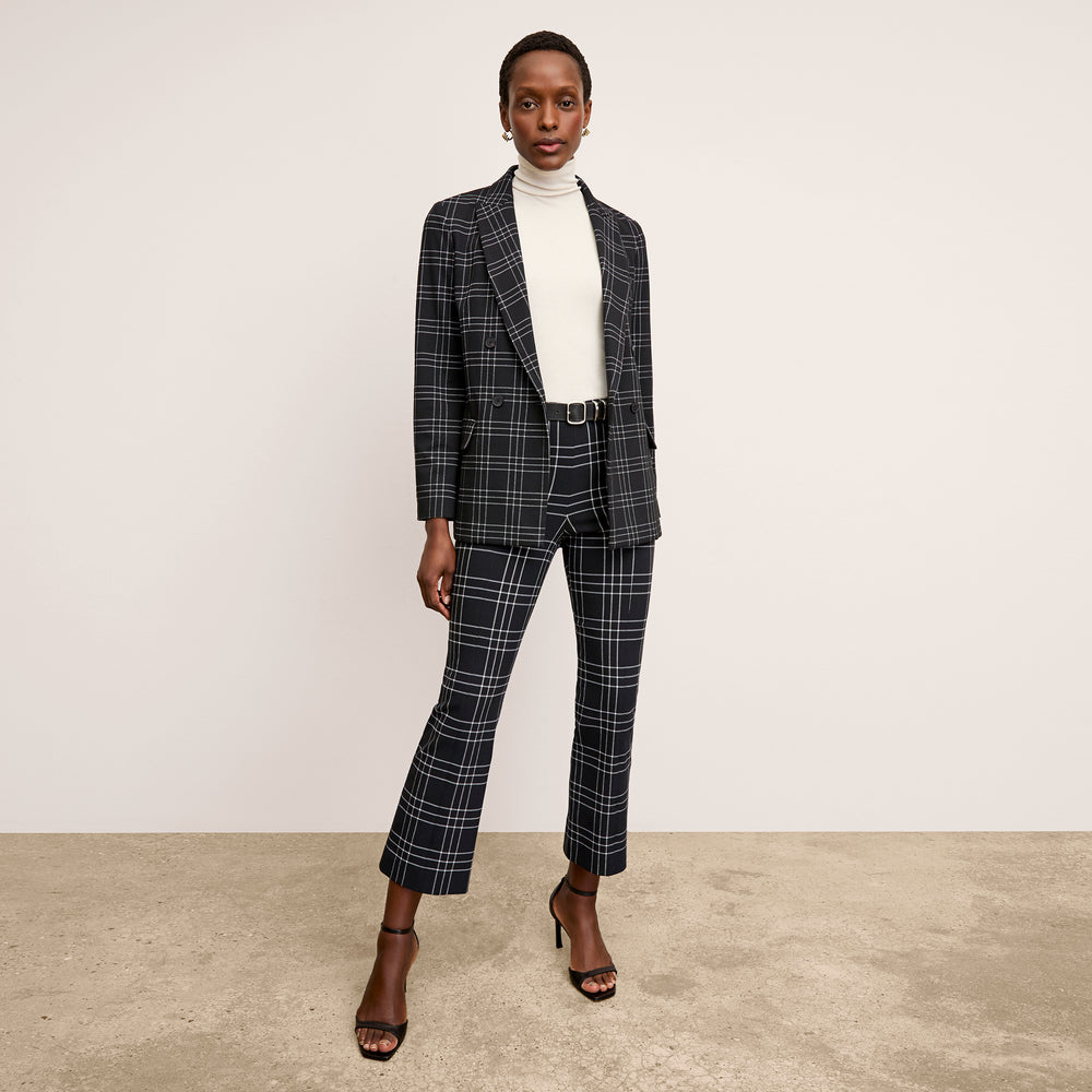 front image of a woman wearing the kick flare foster pant in plaid