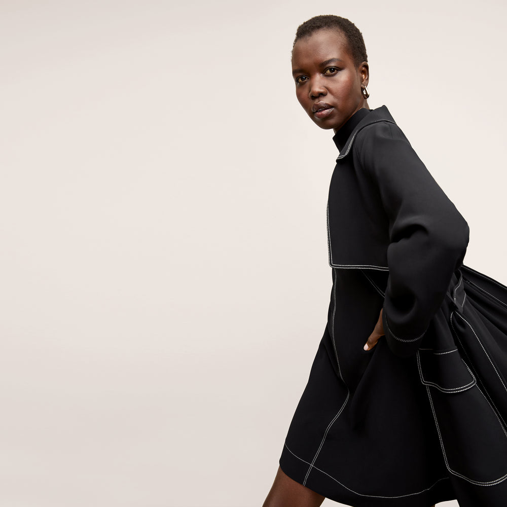 side image of a woman wearing the kinsley dress in black