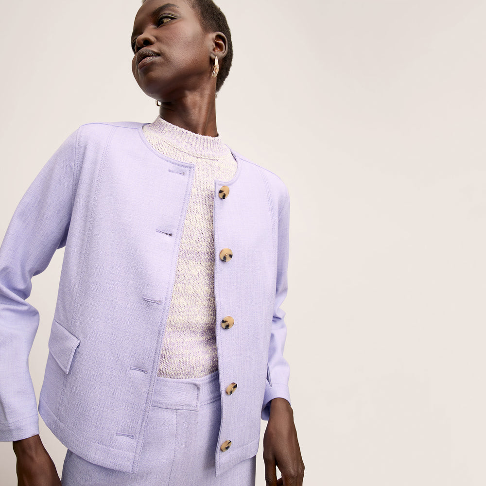 front image of a woman wearing the alexis top in lavender