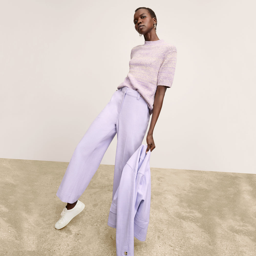 front image of a woman wearing the alexis top in lavender