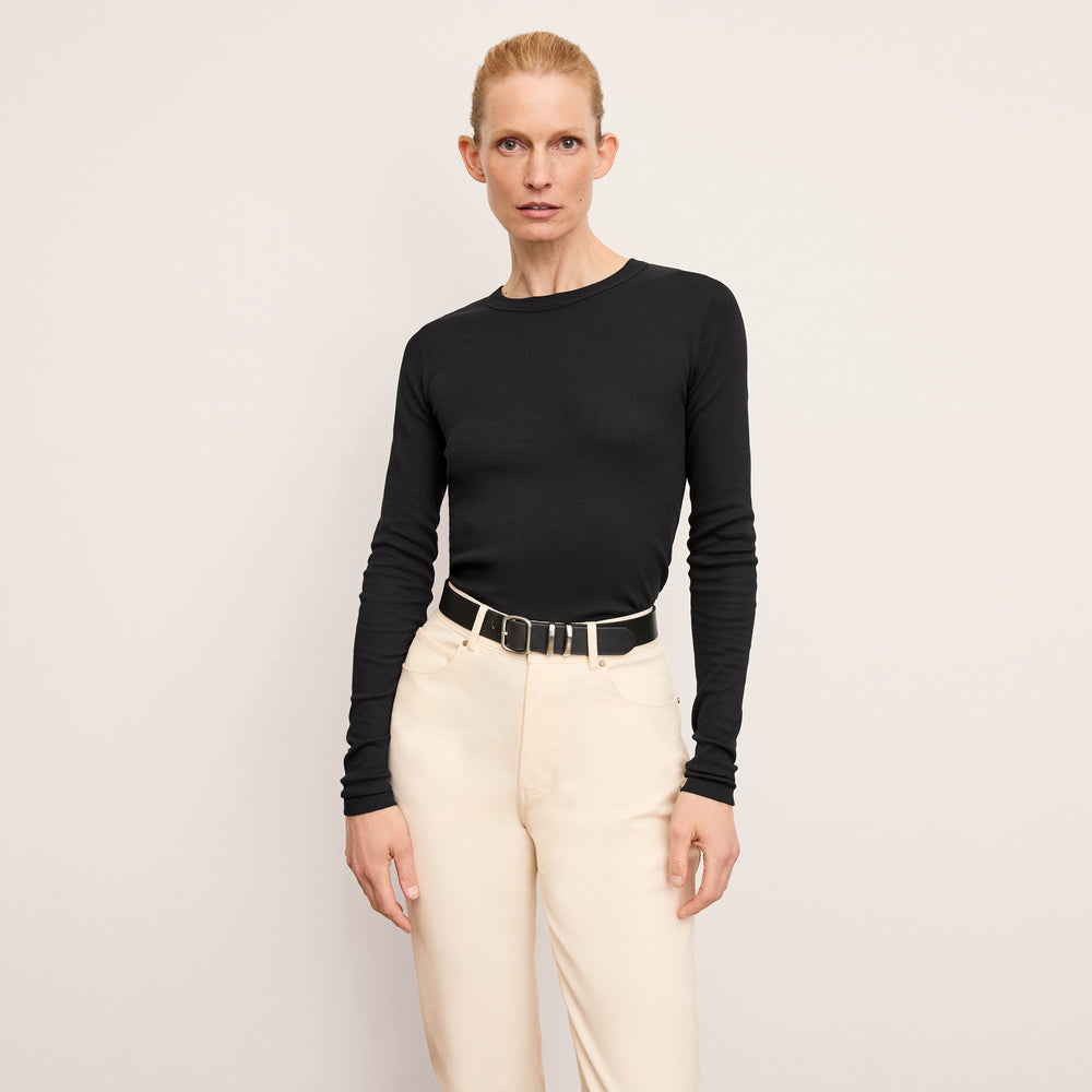 front image of a woman wearing the malley t-shirt in black