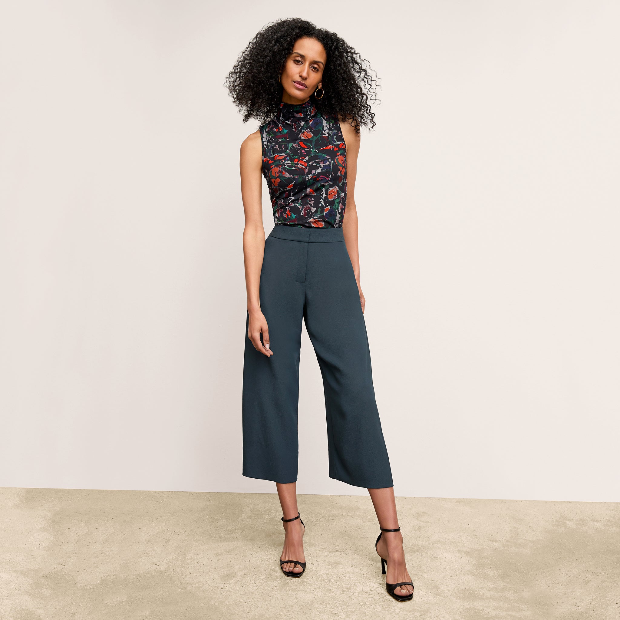 front image of a woman wearing the zhou pant in ocean 