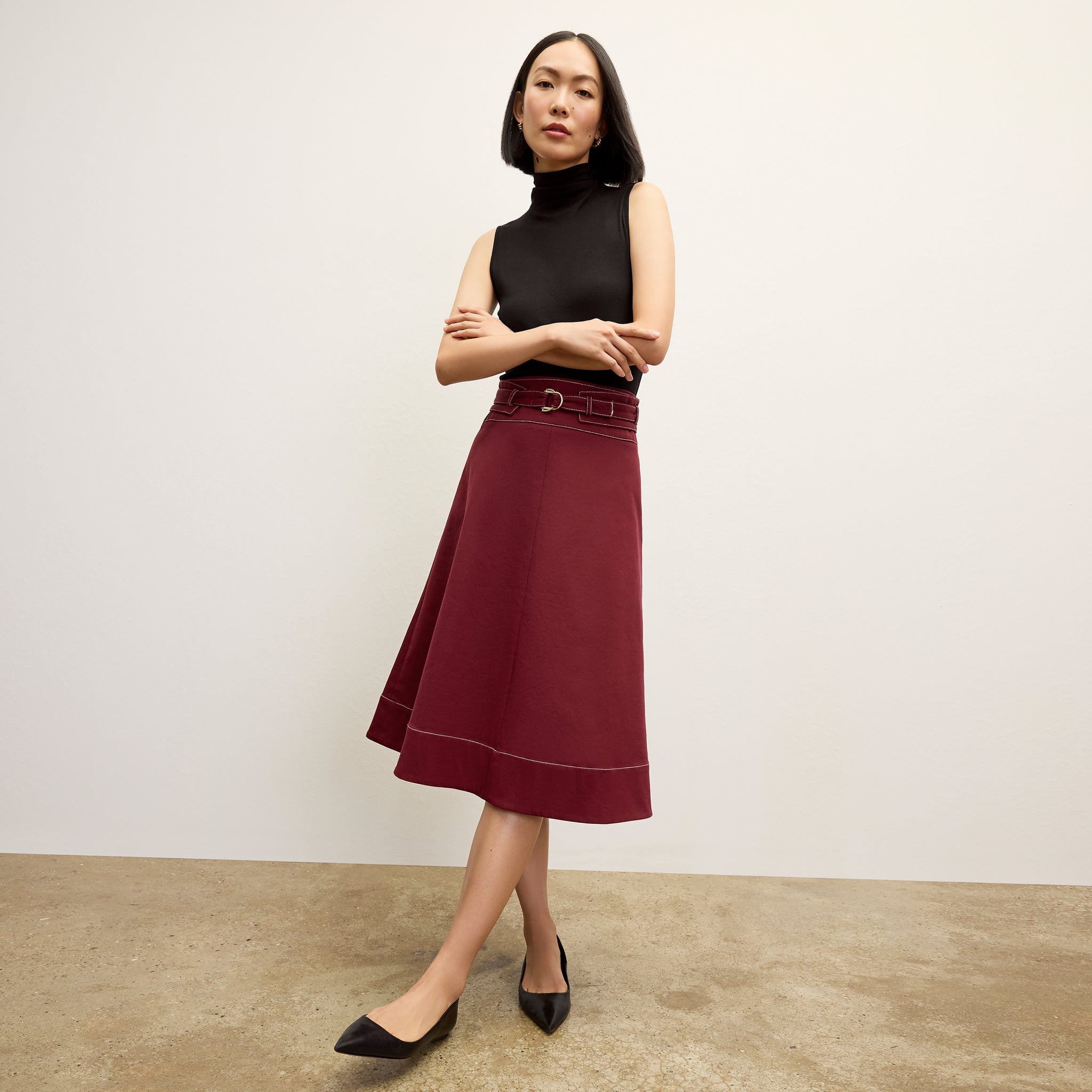 front image of a woman wearing the bodhi skirt in berry jam 