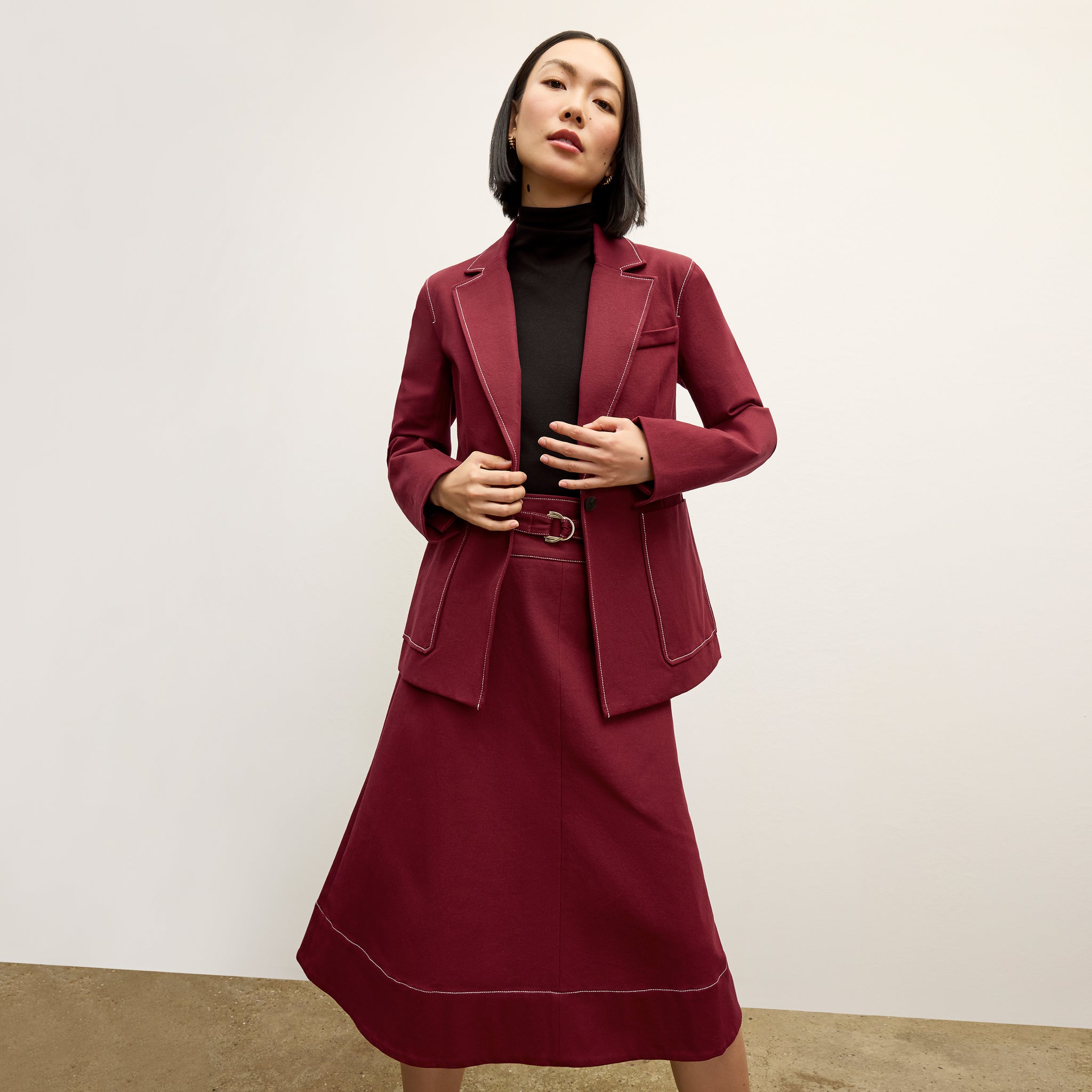 front image of a woman wearing the bodhi skirt in berry jam 