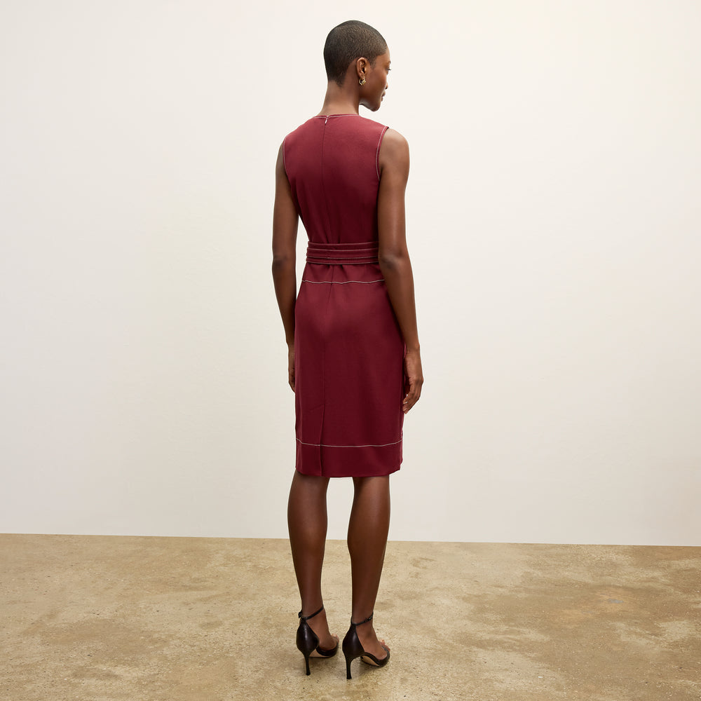 back image of a woman wearing the maude dress in berry jam