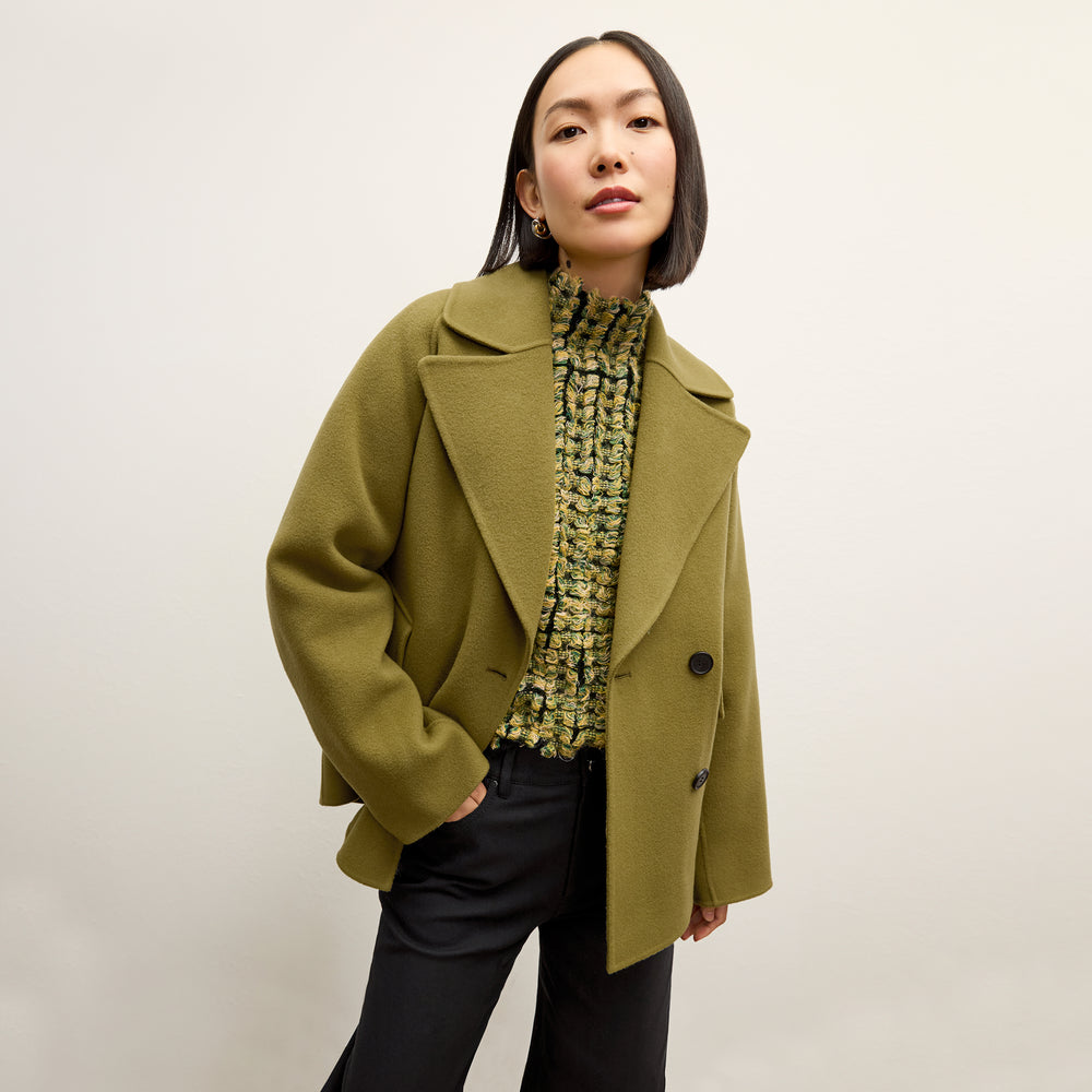 front image of a woman wearing the Rajni Sweater in multi