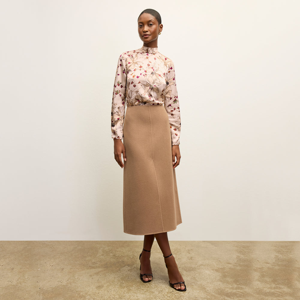 front image of a woman wearing the sohee top in botanical print